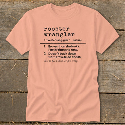 Peach t-shirt with definition of "rooster wrangler" and "villain origin story."