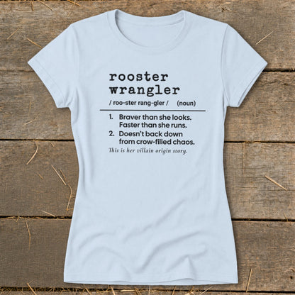 Light blue t-shirt with "rooster wrangler" definition and "villain origin story".