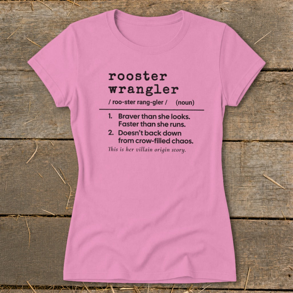 Pink t-shirt with "rooster wrangler" definition and "villain origin story" text.