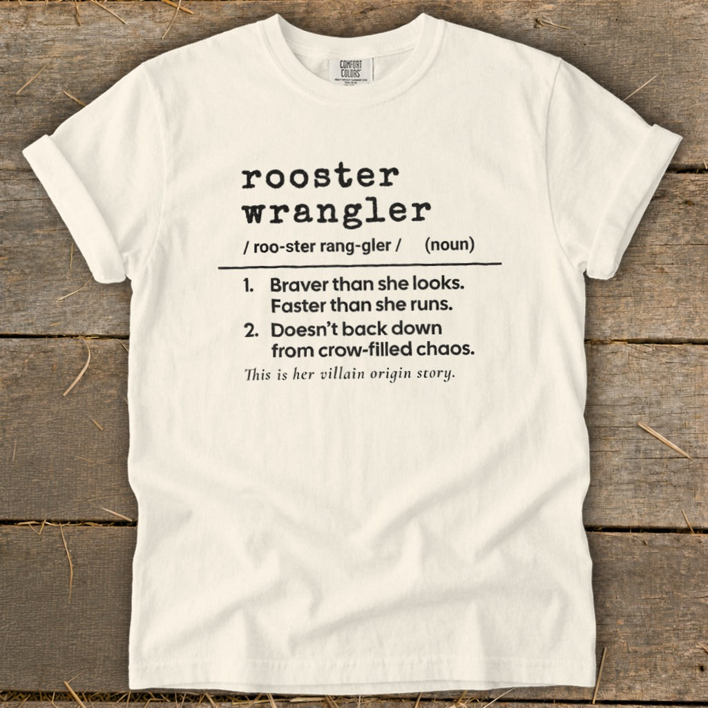 White t-shirt with "rooster wrangler" definition: Braver than she looks, faster than she runs.