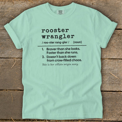 Mint green t-shirt with "rooster wrangler" definition including its origin story.