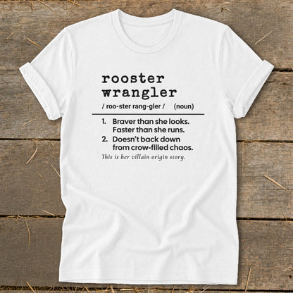 White t-shirt with "rooster wrangler" definition and "villain origin story" text.