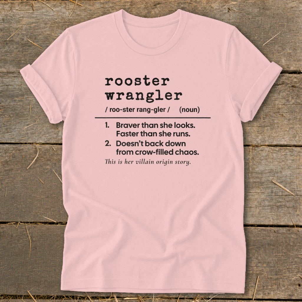 Pink t-shirt with "rooster wrangler" definition and "villain origin story."