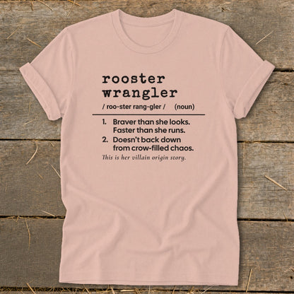 Pink t-shirt with "rooster wrangler" definition text.