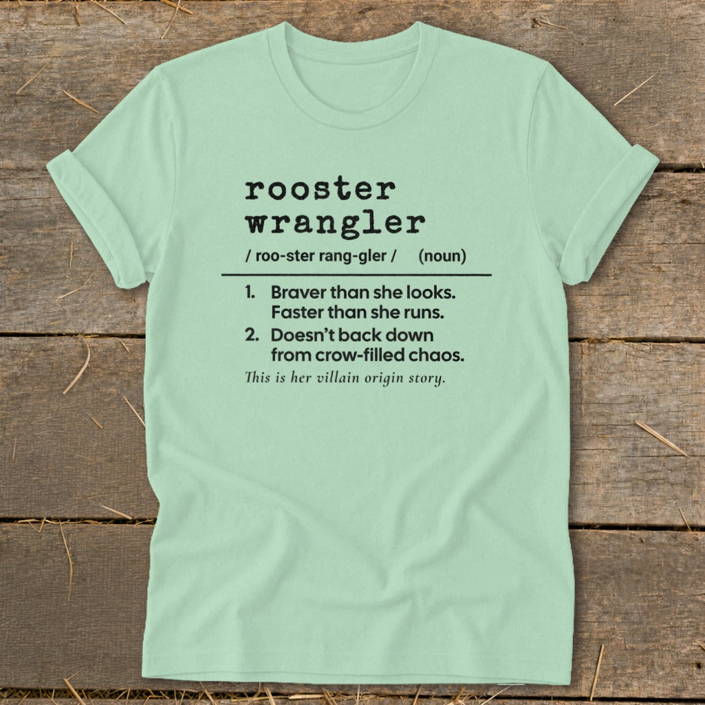 Light green t-shirt with "rooster wrangler" definition in black text.