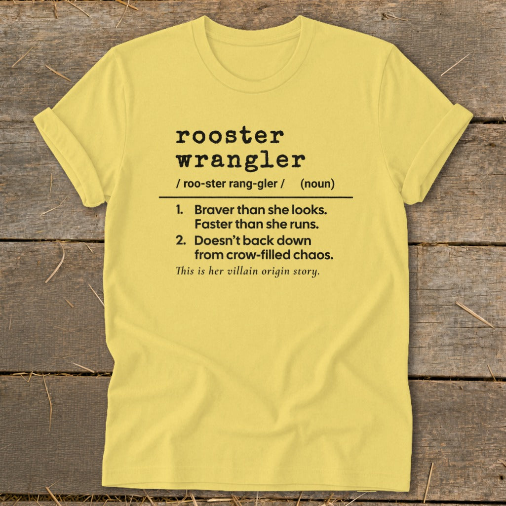 Yellow t-shirt with "rooster wrangler" definition and "villain origin story" text.