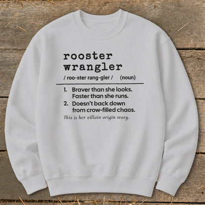 White sweatshirt with "rooster wrangler" definition including traits and villain origin story.