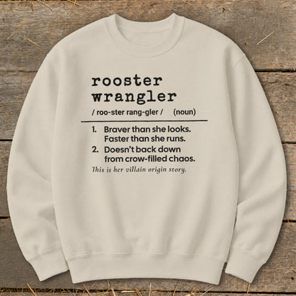 Cream sweatshirt with "rooster wrangler" definition: "Braver than she looks..."