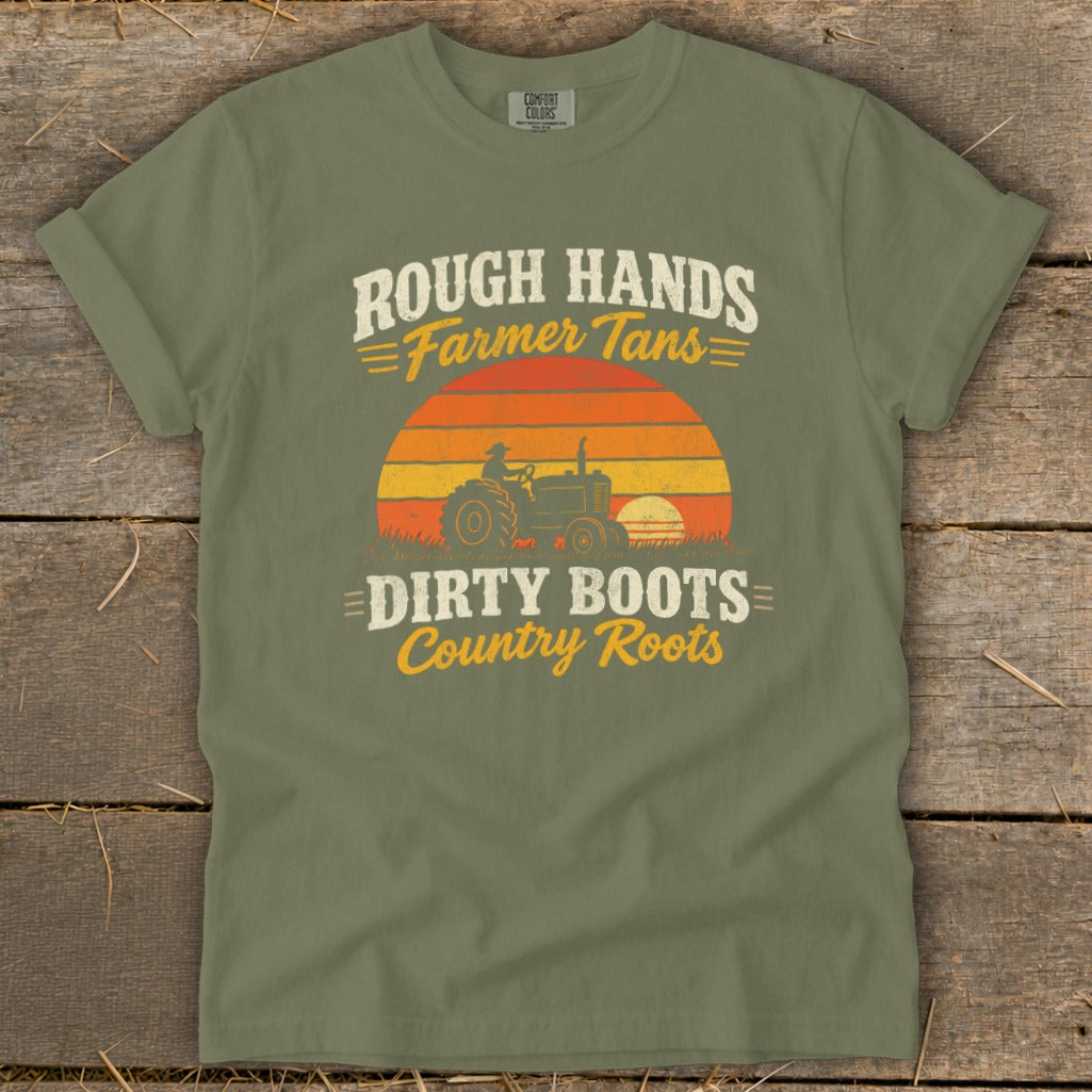 Olive green t-shirt featuring a retro graphic of a tractor against a sunset with text that reads Rough Hands Farmer Tans Dirty Boots Country Roots.