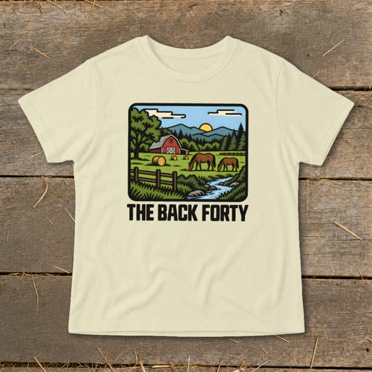 Cream-colored t-shirt featuring a cartoon rural farm landscape graphic and the text "The Back Forty".