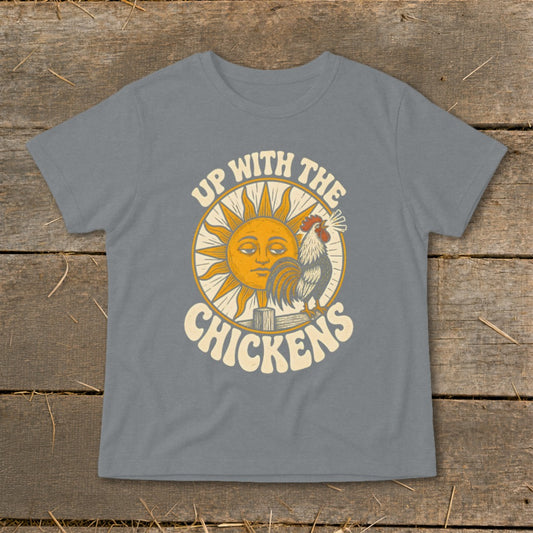 A grey t-shirt featuring a retro graphic of a rooster crowing beside a smiling sun with text reading Up With The Chickens.