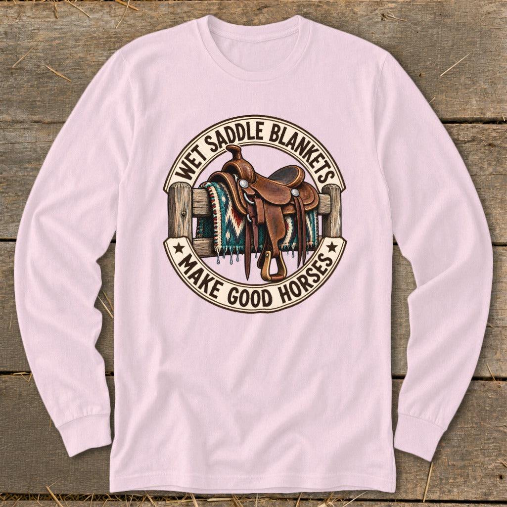 Western saddle and blanket on fence with text "Wet Saddle Blankets Make Good Horses".