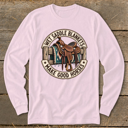 Western saddle and blanket on fence with text "Wet Saddle Blankets Make Good Horses".