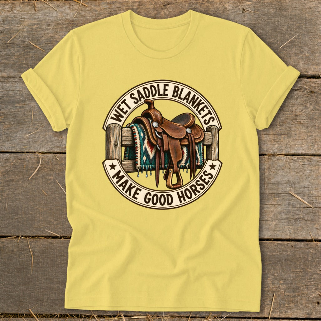 Yellow t-shirt with western saddle on a fence and text "Wet Saddle Blankets Make Good Horses".