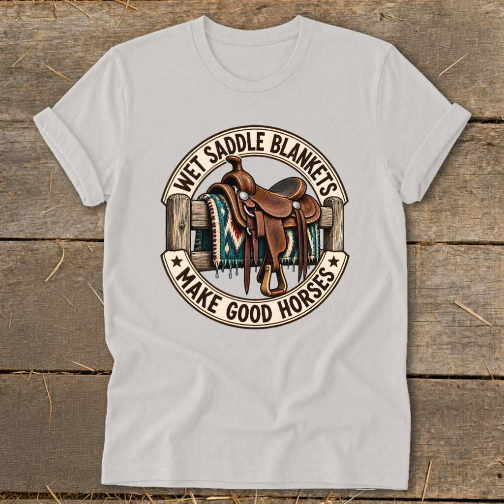 Light gray t-shirt with a round graphic of a saddle and blanket on a fence.