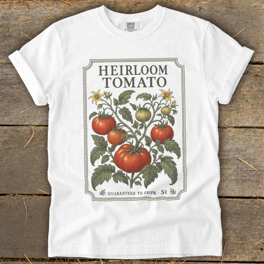 White t-shirt with "Heirloom Tomato" text and vintage illustration of tomato plant.