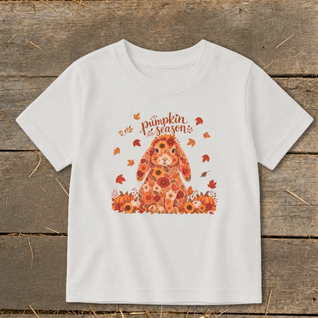 White t-shirt with a floral bunny, pumpkins, and "pumpkin season" text.
