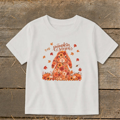 White t-shirt with a floral bunny, pumpkins, and "pumpkin season" text.