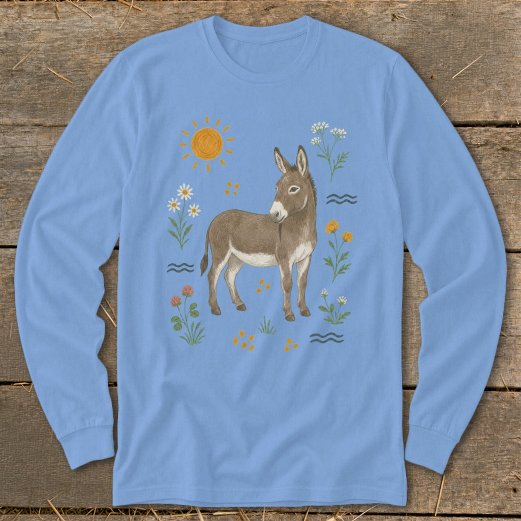 Light blue long-sleeve shirt with a cartoon donkey surrounded by sun, flowers, and waves.
