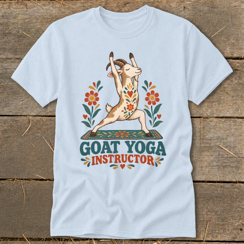 Light blue t-shirt with a goat in a yoga pose, surrounded by flowers and text "GOAT YOGA INSTRUCTOR".