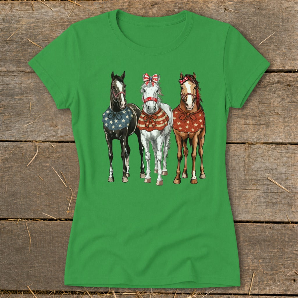 Three horses with patriotic bandanas and bows stand side by side.