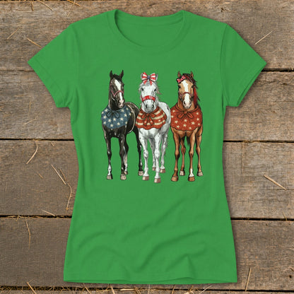 Three horses with patriotic bandanas and bows stand side by side.