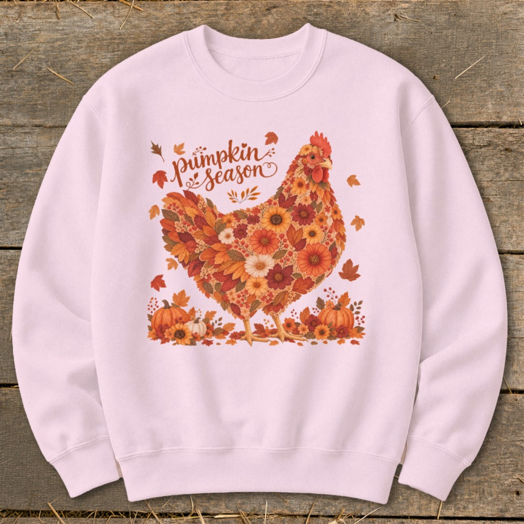 Pink sweatshirt with a chicken design made of fall flowers and leaves.