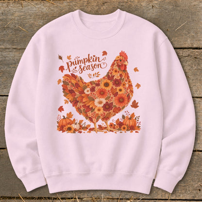 Pink sweatshirt with a chicken design made of fall flowers and leaves.