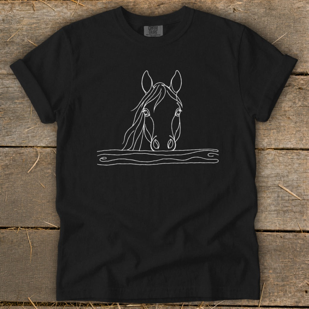 Black t-shirt with white line drawing of a horse's head above wooden planks.
