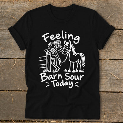 Black t-shirt with white text and drawing of a girl and horse saying "Feeling Barn Sour Today".