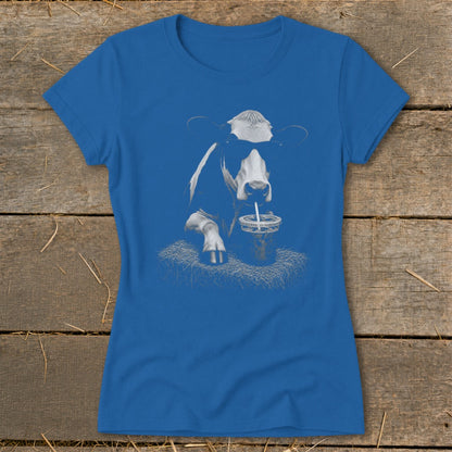 Cow wearing sunglasses drinks from a straw in a cup, printed on a blue t-shirt.