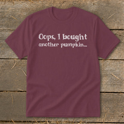 Maroon t-shirt with white text reading "Oops, I bought another pumpkin..."