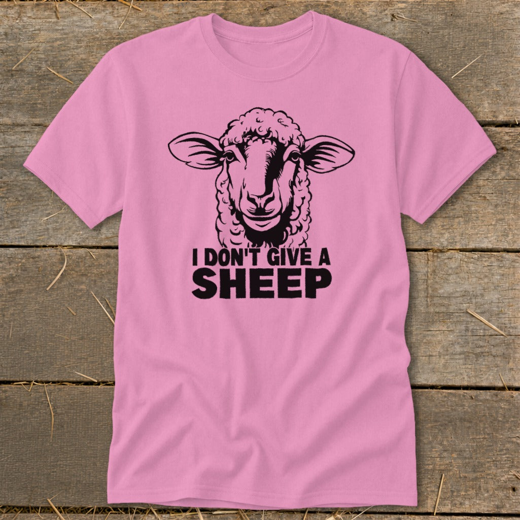 Pink t-shirt with black sheep graphic and text "I DON'T GIVE A SHEEP".