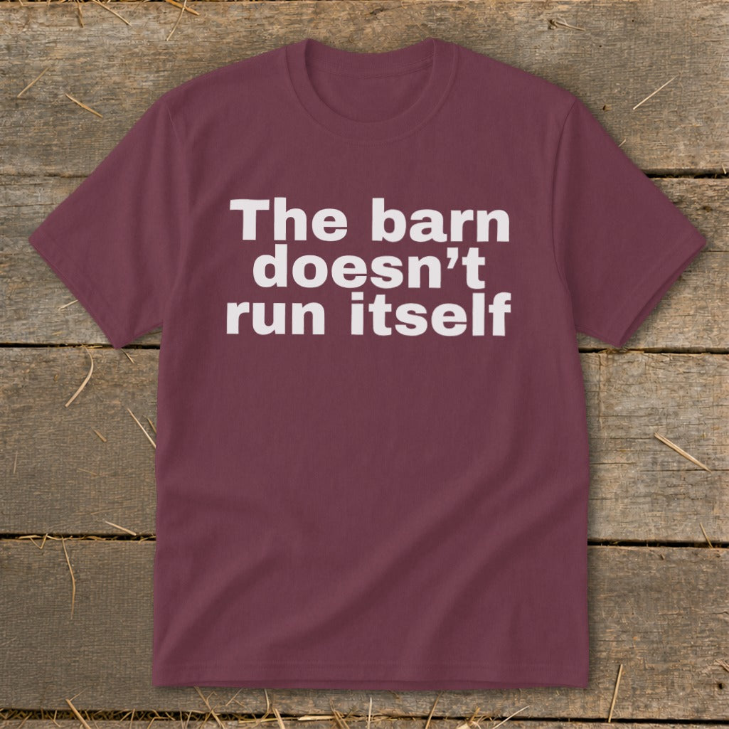 Maroon t-shirt with white text "The barn doesn't run itself".