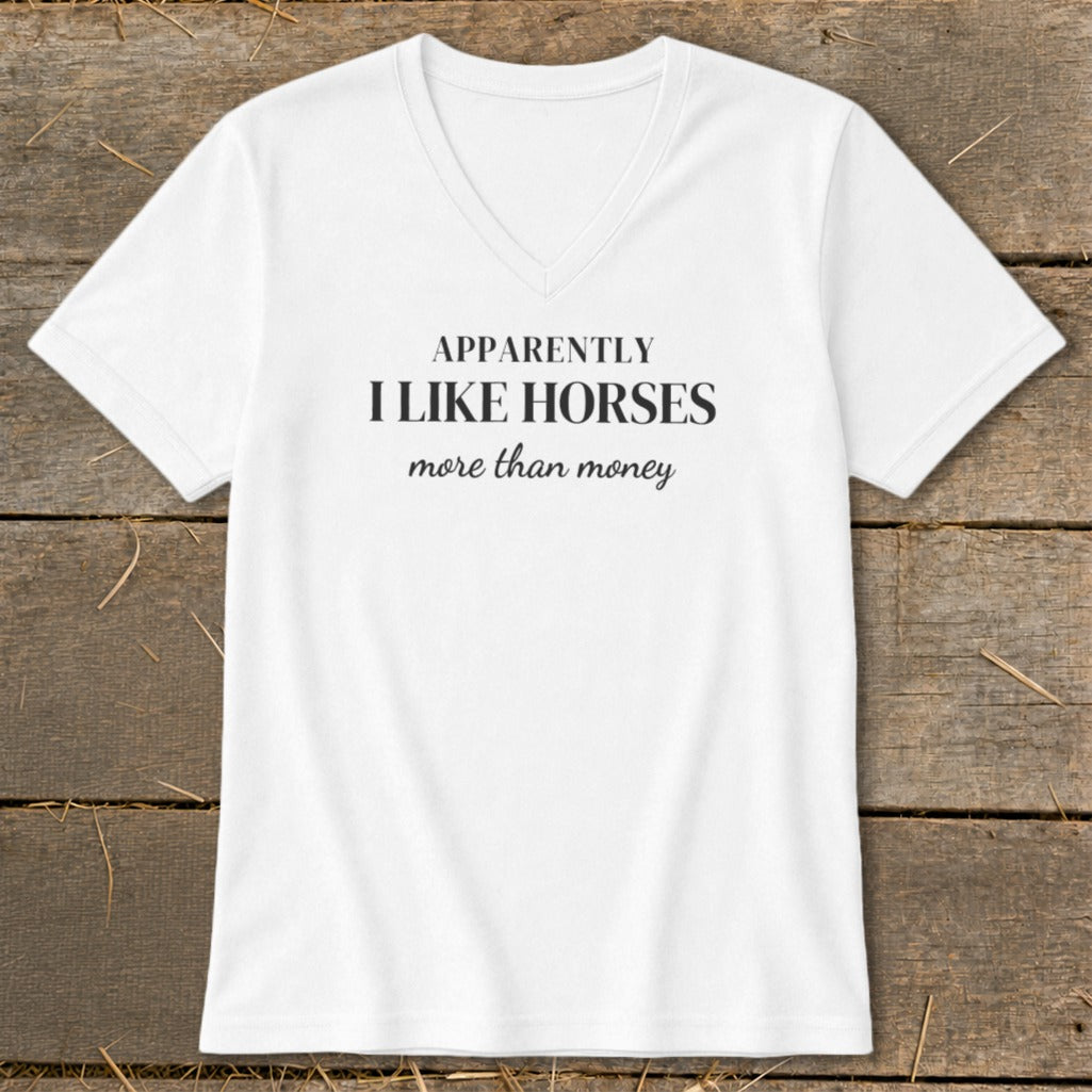 White V-neck t-shirt with "APPARENTLY I LIKE HORSES more than money" text.
