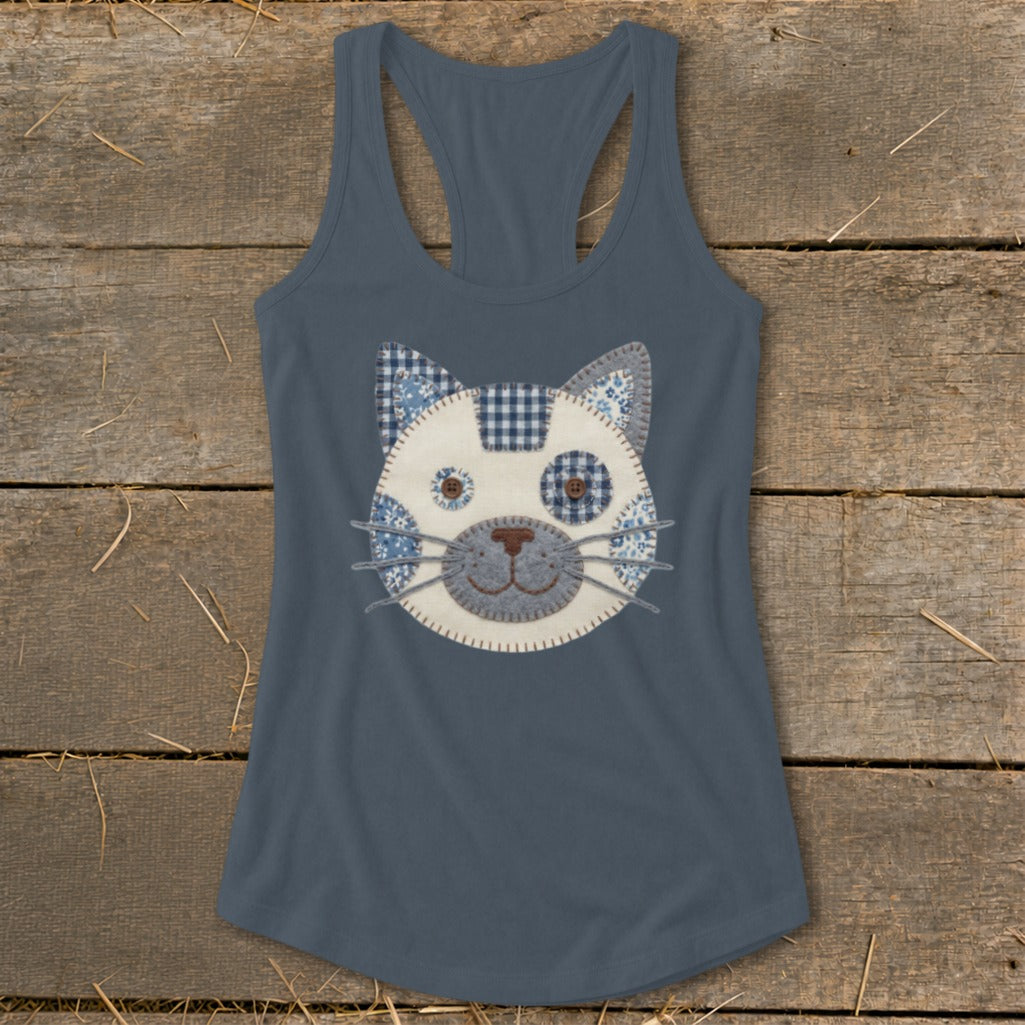 Blue racerback tank top with a stitched cat face applique in blue and white patterns.