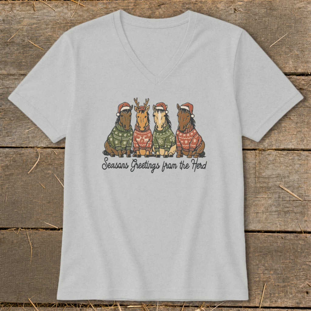 T-shirt with four horses in Christmas sweaters and Santa hats, saying "Seasons Greetings from the Herd".