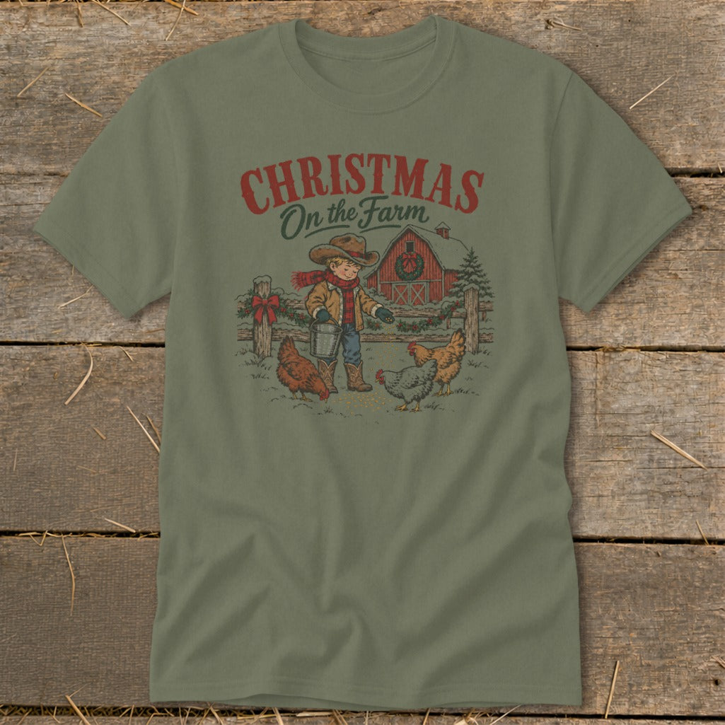 Green t-shirt with "Christmas On the Farm" text and illustration of a child feeding chickens.