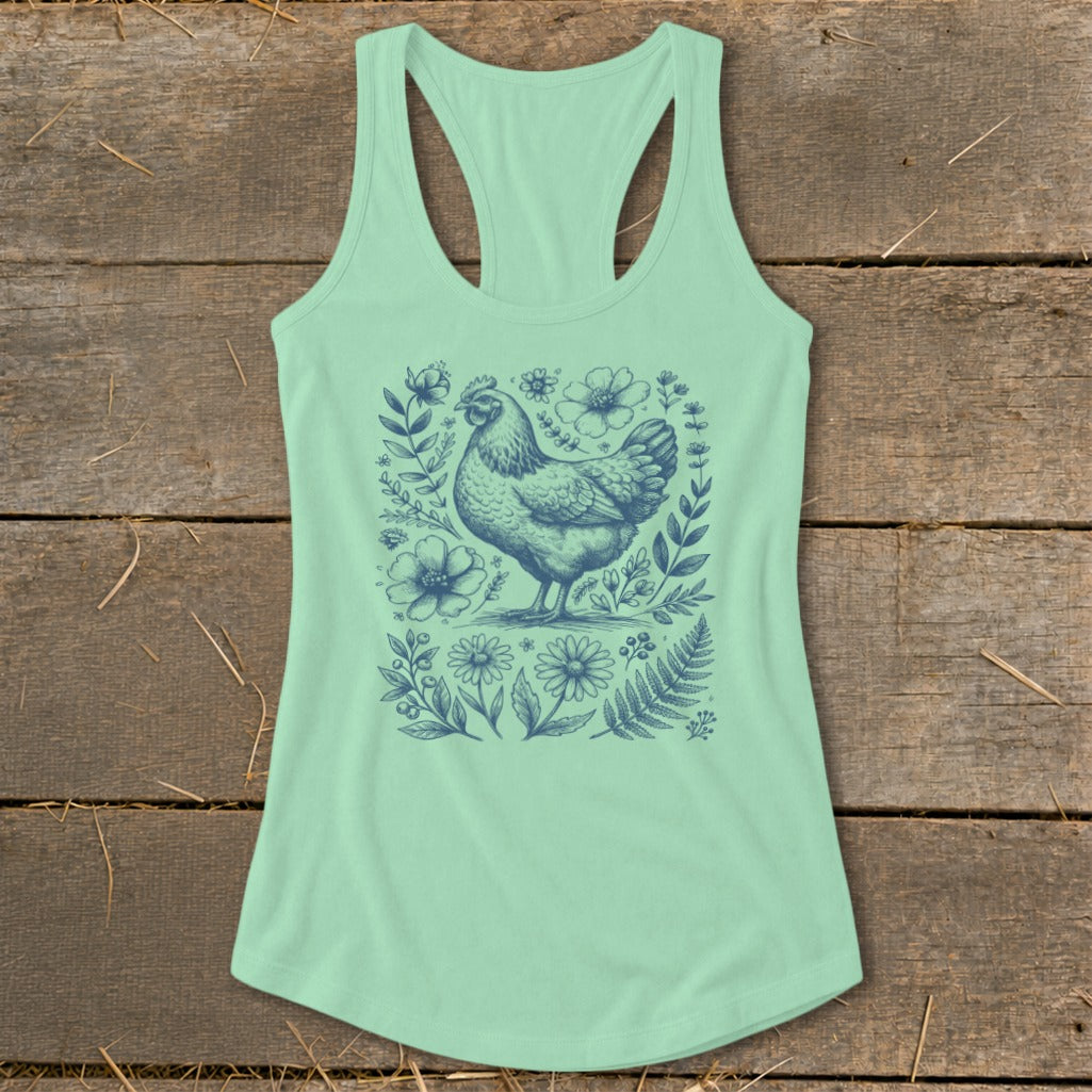 Mint green tank top with a blue chicken and floral graphic print.