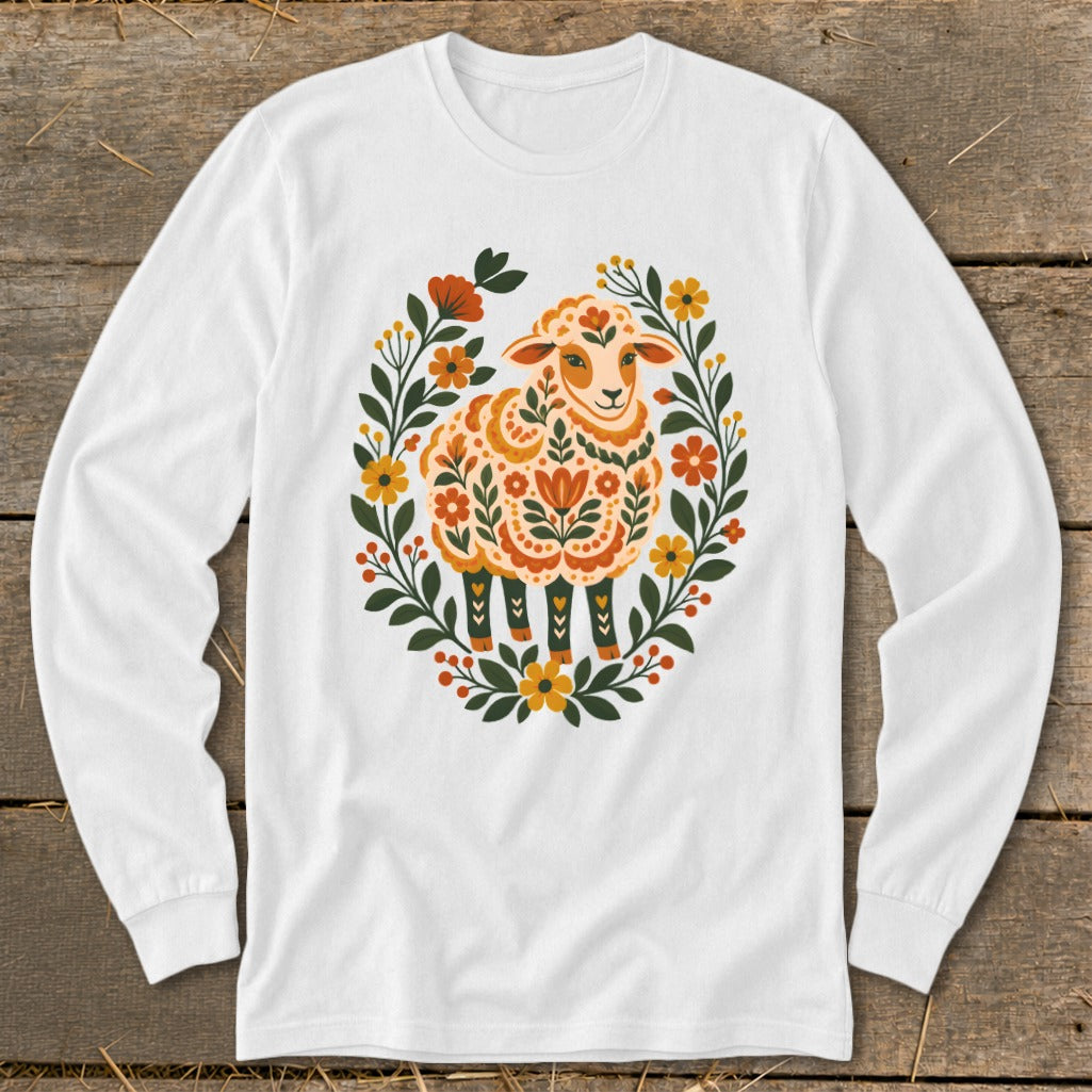 White long-sleeve shirt with a floral sheep graphic in orange and yellow hues.