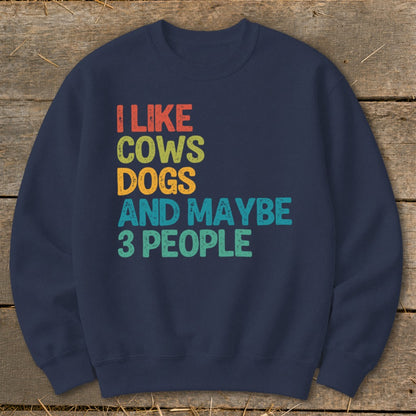 Navy sweatshirt with retro text "I LIKE COWS DOGS AND MAYBE 3 PEOPLE".