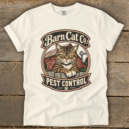 Off-white t-shirt featuring a vintage graphic of a tabby cat, barn, windmill, and text reading Barn Cat Co. Pest Control.