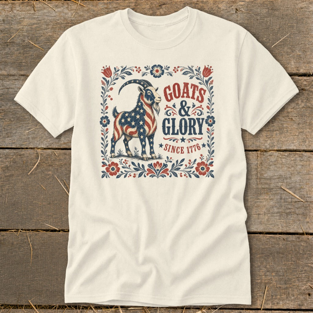 Cream t-shirt with American flag goat graphic and text "GOATS & GLORY SINCE 1776".