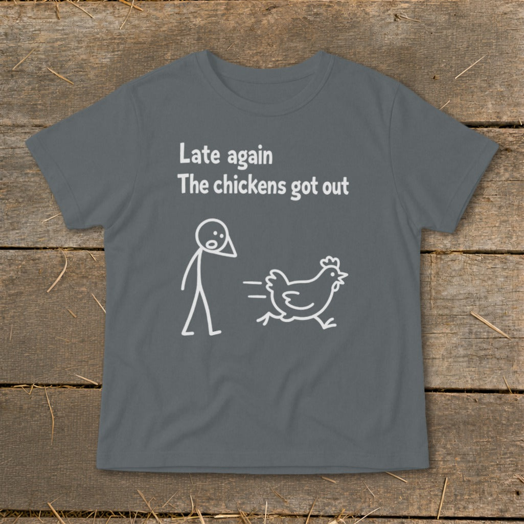 T-shirt with text "Late again. The chickens got out" and cartoon drawings.