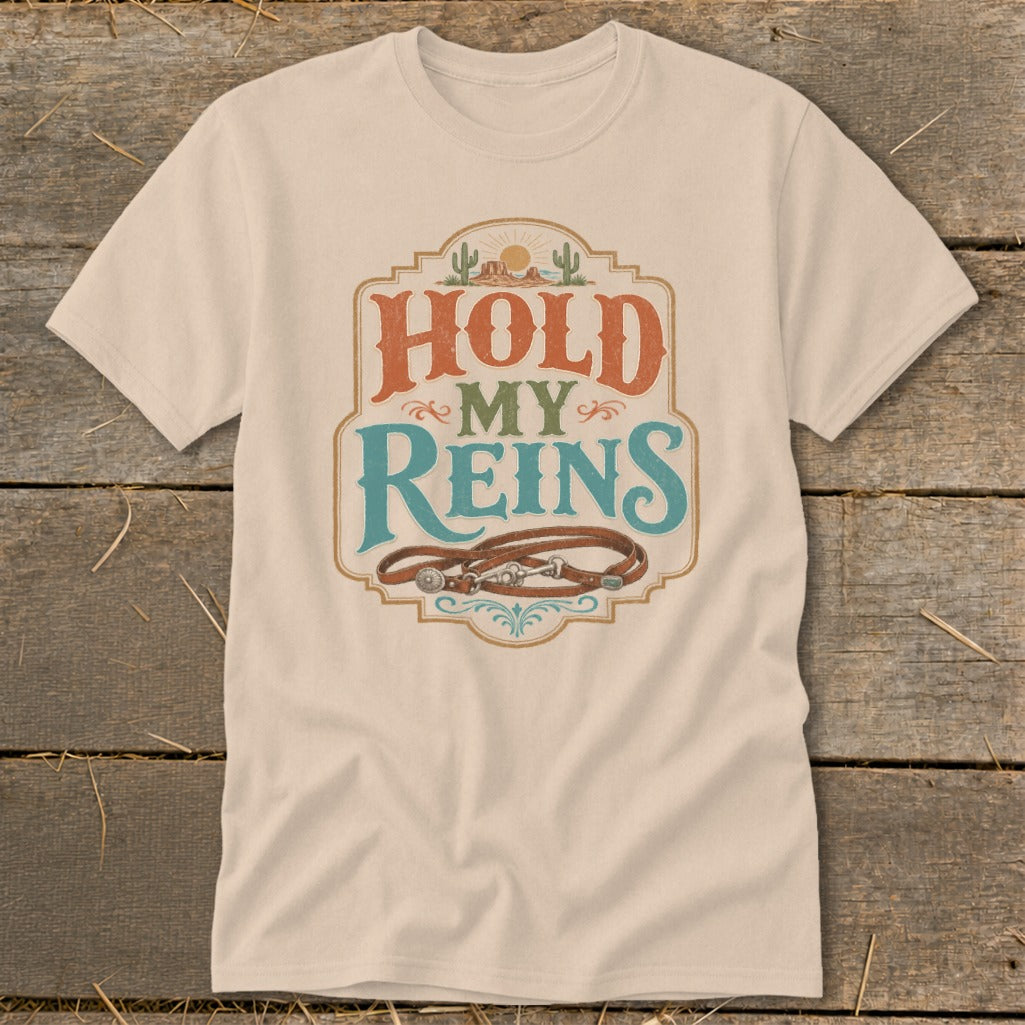 T-shirt with "Hold My Reins" graphic and leather horse reins.