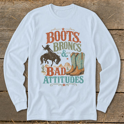 Long sleeve t-shirt with "Boots, Broncs & Bad Attitudes" text and graphic.