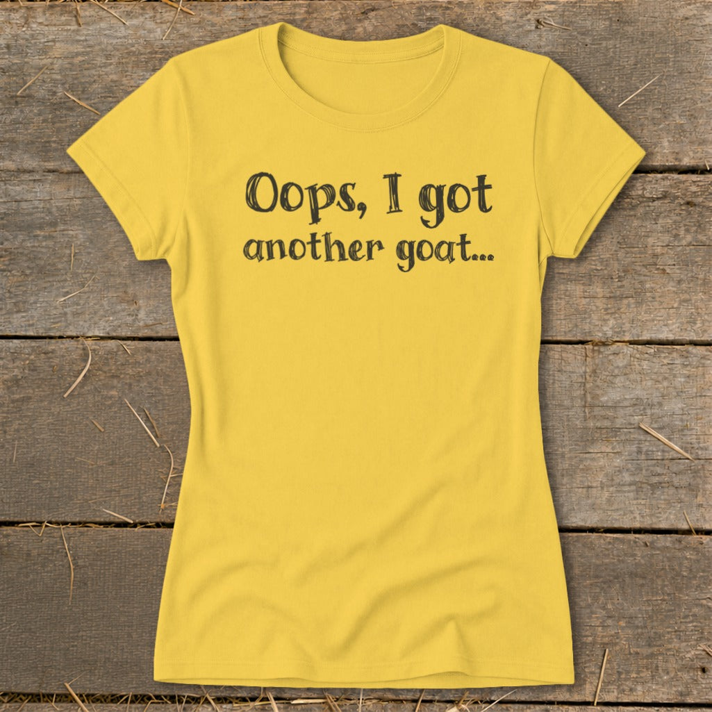 Yellow t-shirt with black text "Oops, I got another goat..."