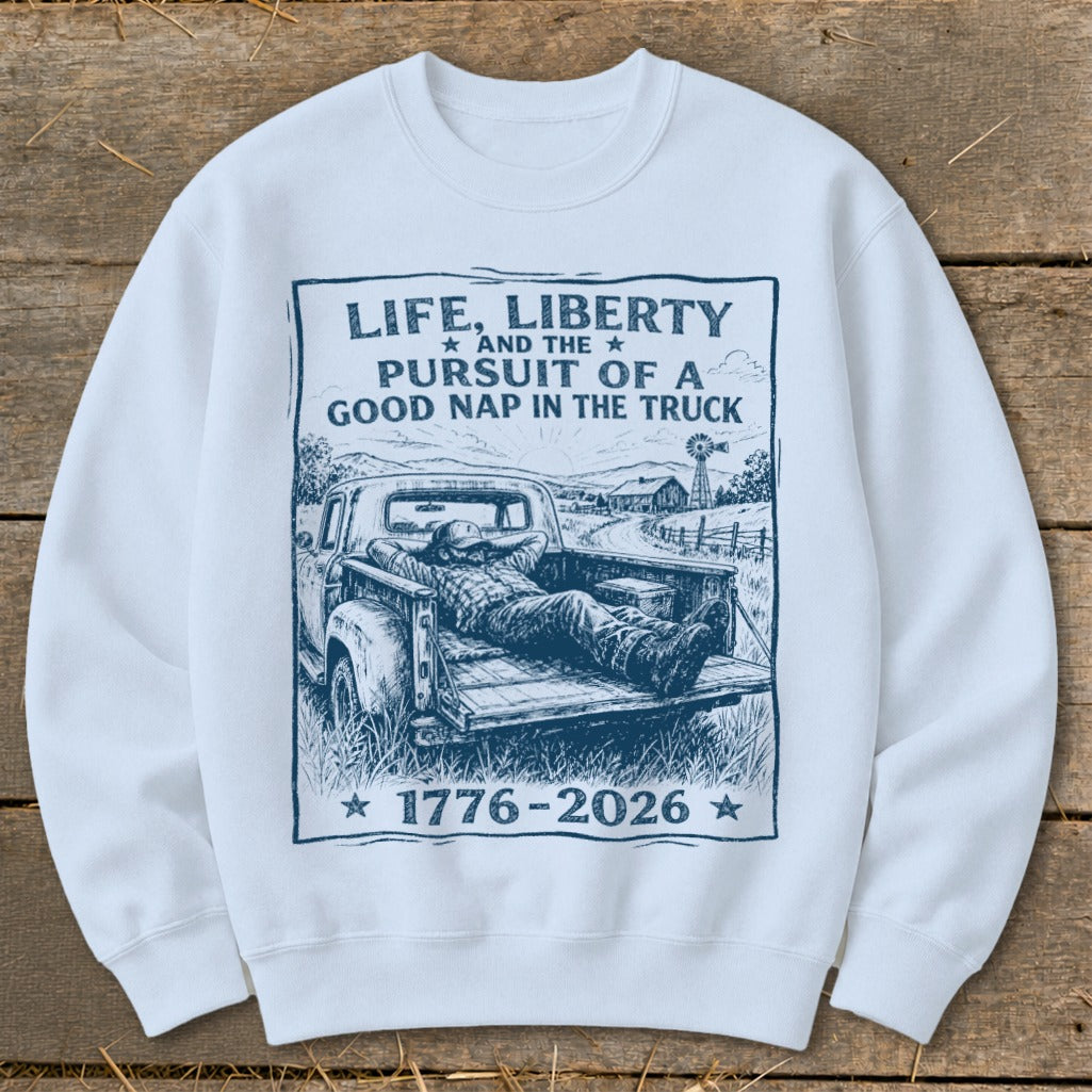 Sweatshirt with "Life, Liberty and the Pursuit of a Good Nap in the Truck" and 1776-2026 graphic.