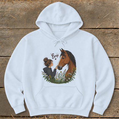 White hoodie with "Boop" text and illustration of girl touching horse nose.