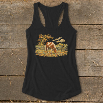 Black tank top with a painted scene of a brown and white horse grazing among autumn leaves.